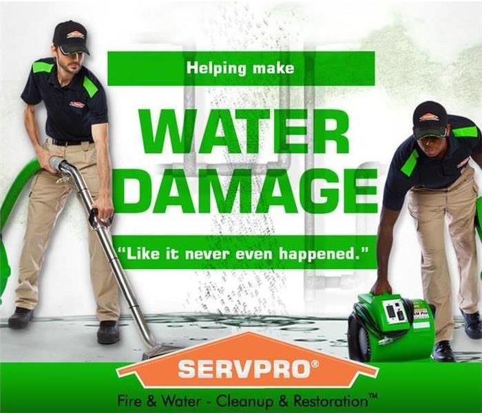 Two SERVPRO employees cleaning up water with water damage in green letters and a SERVPRO house logo on the bottom.