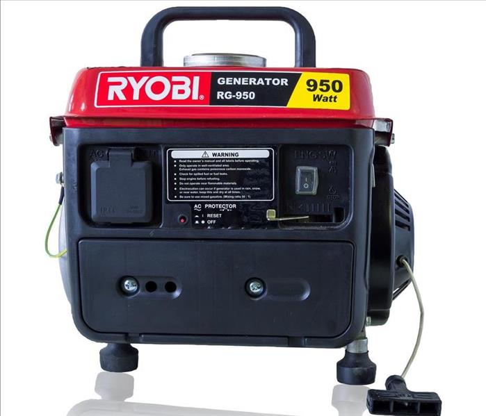 Portable red & black generator with a white background.